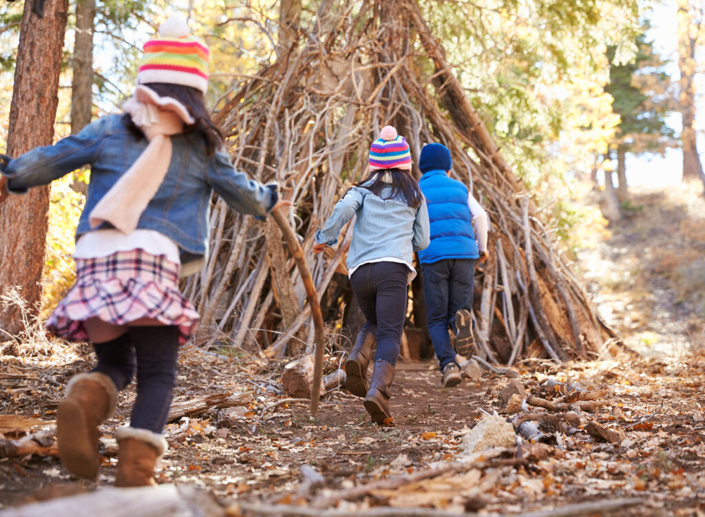 children playing by a tree