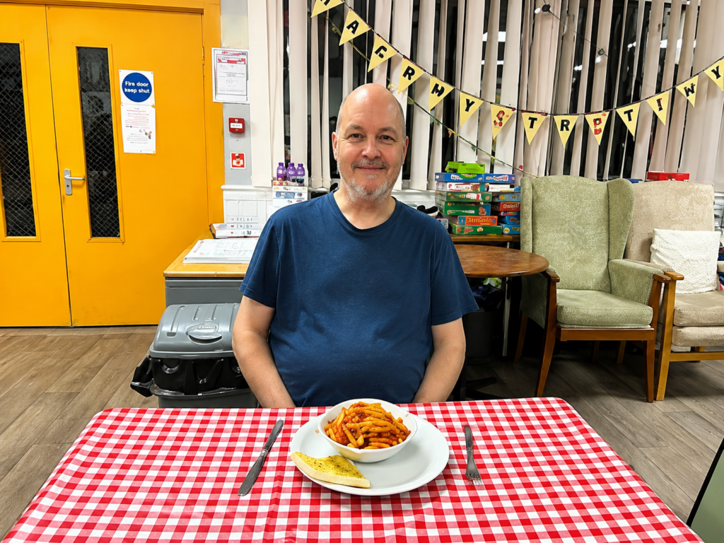 A man at a FoodCycle table