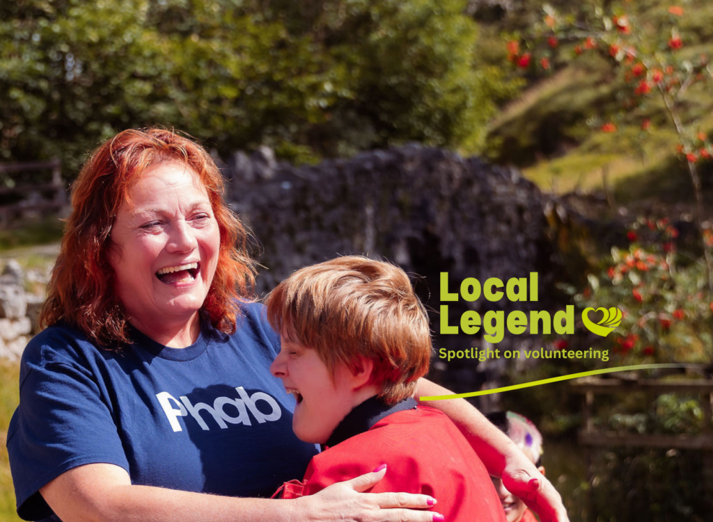 A woman and a boy in a red jacket hug. There is a logo that says: local legend