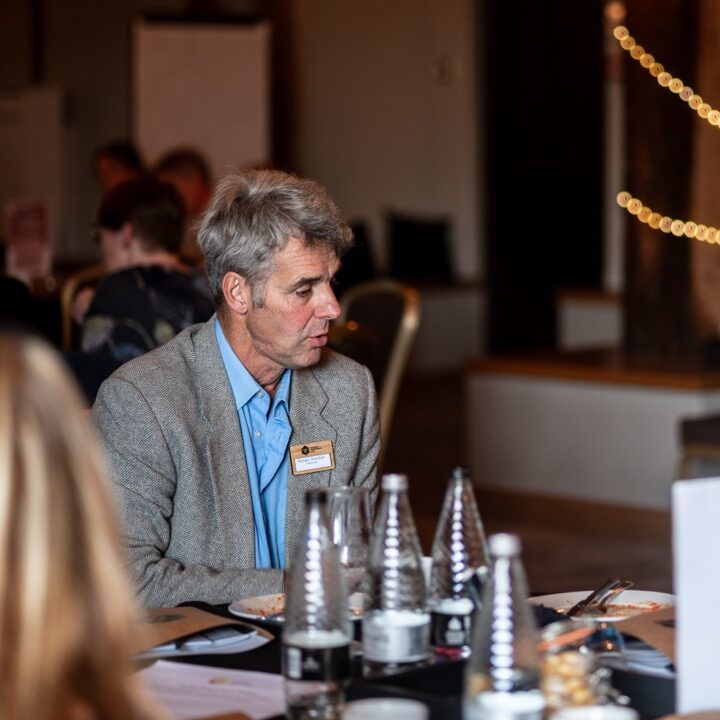 A man chats at a conference