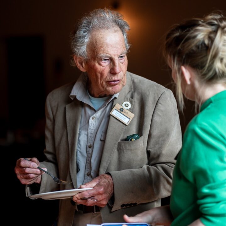 A man at a conference chats